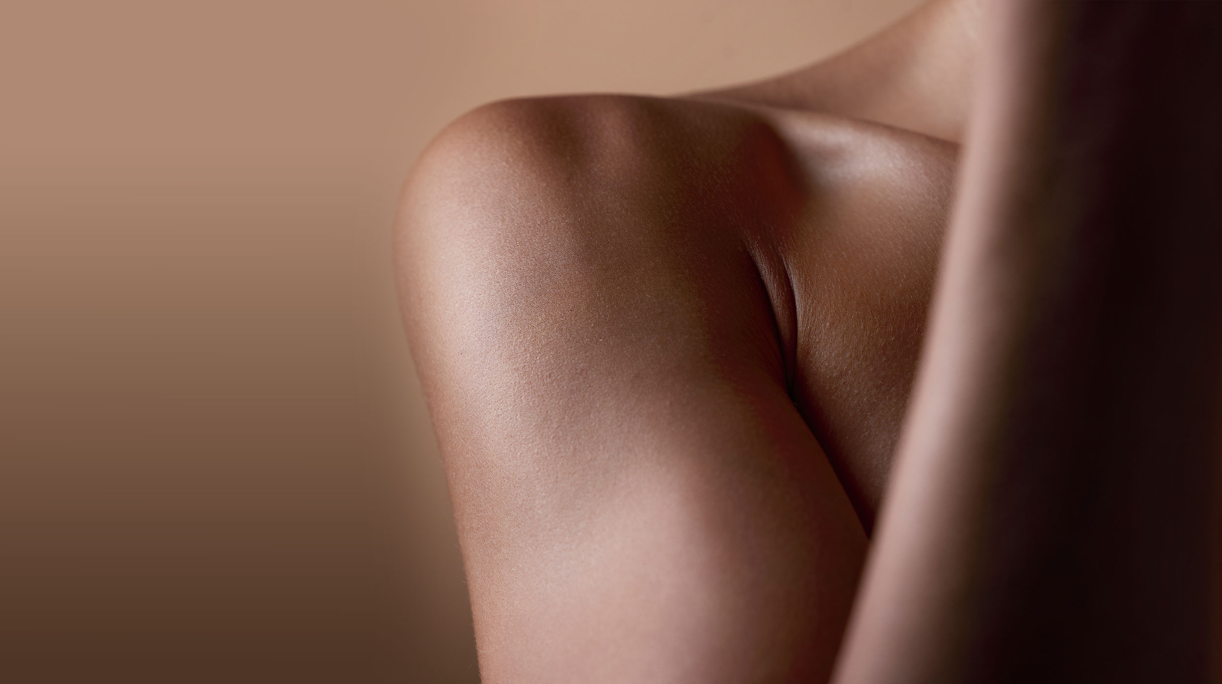 Close-up of a woman's neck and shoulder