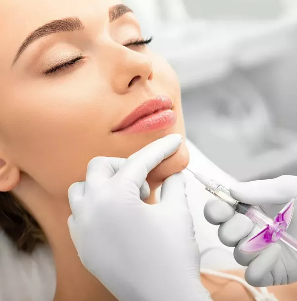 Woman's face receiving an injection